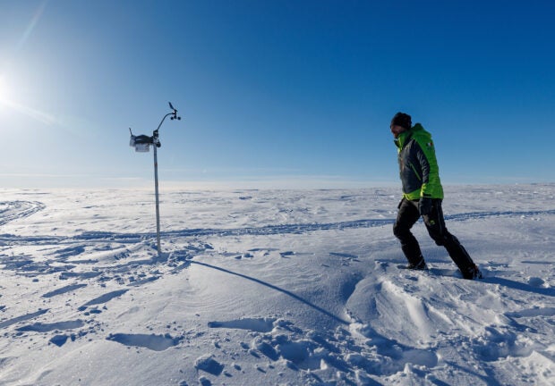 CNR (Italian National Research Council) geochemist and expedition leader Andrea Spolaor, 39, walks along the Ice Memory drilling camp, near Ny-Aalesund, Svalbard, Norway, April 10, 2023. A team of scientists was drilling 125 meters into Dovrebreen glacier, hoping to collect two ice cores for studying 300 years of climate records – part of an effort by the non-profit Ice Memory Foundation to collect and preserve ice cores from melting glaciers around the world – and were shocked when the drill, at only 25 meters deep, suddenly sloshed into a massive pool of water. "We did not expect such a huge water flux coming out from the glacier, and this is a clear sign of what is happening in this region," Spolaor said. "The glacier is suffering." REUTERS/Lisi Niesner