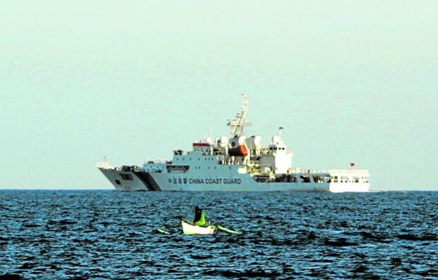 TRADITIONAL FISHING GROUND In this November 2016 photo, a Filipino fisherman catches fish as the China Coast Guard patrols Panatag (Scarborough) Shoal in the West Philippine Sea, a traditional fishing ground for Zambales and Pangasinan fishers. —RICHARD A. REYES