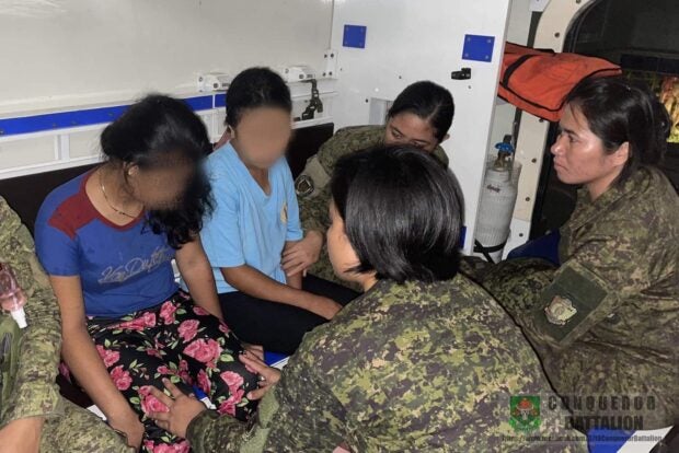 WOMEN soldiers assist the wounded NPA woman combatant inside a hospital. Troops of the 37th Infantry Battalion found her after a firefight in Barangay Hinalaan, Kalamansig Sultan Kudarat on July 19. CONTRIBUTED PHOTOS FROM THE PHILIPPINE ARMY