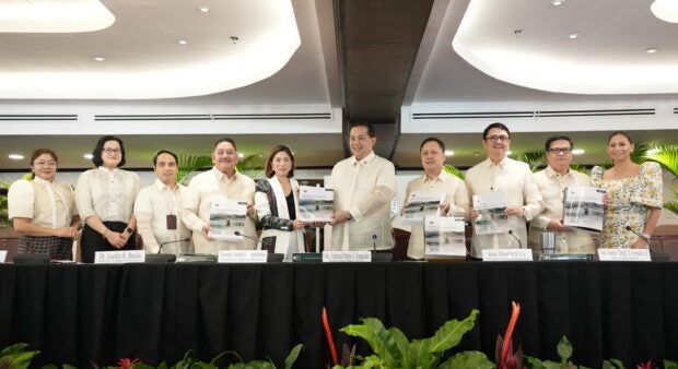 Department of Budget and Management Sec. Amenah Pangandaman turns over a copy of the proposed P5.768 trillion 2024 National Expenditure Program (NEP) to Speaker Ferdinand Martin G. Romualdez Wednesday morning at the Romualdez Hall of the House of Representatives. With them are (from left) DBM Asec. Mary Anne Dela Vega, Usec. Janet Abuel, Dr. Joselito Basilio, House Minority Leader Marcelino Libanan, Committee on Appropriations Chairman Rep. Zaldy Co, Senior Deputy Speaker Aurelio "Dong" Gonzales Jr., Majority Leader Manuel Jose "Mannix" M. Dalipe, and House Committee on Appropriations Vice Chairperson Stella Luz Quimbo.