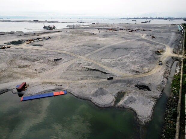 TAKING SHAPE Reclamation of this section of Manila Bay along J.W. Diokno Boulevard in Pasay City has been ongoing, as shown in this photo taken on June 25. Environmental advocates have expressed alarm over the impact of reclamation activities on Manila Bay’s marine biodiversity. —GRIG C.MONTEGRANDE